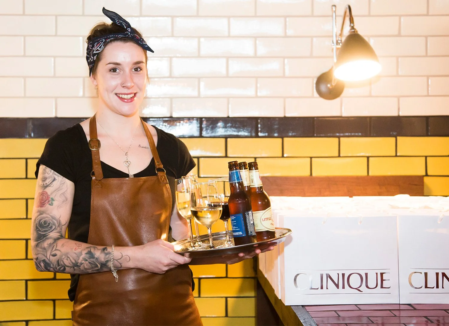 Waiter holding tray of drinks at brand activation experience