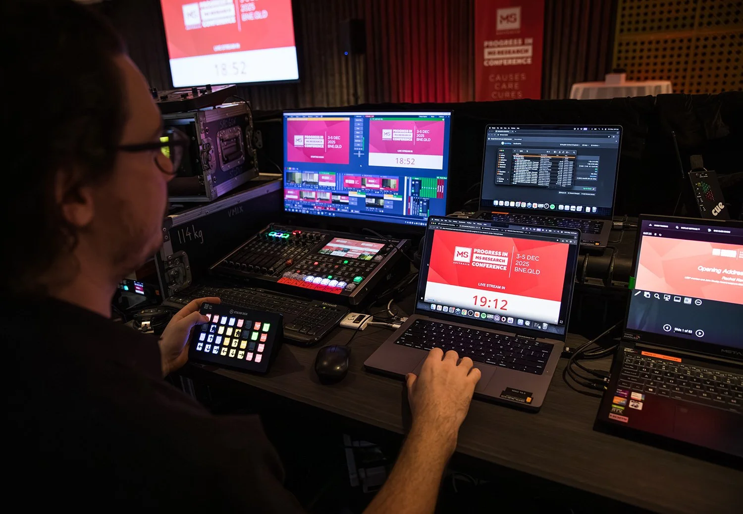 Behind the scenes tech desk in action at a Brisbane conference