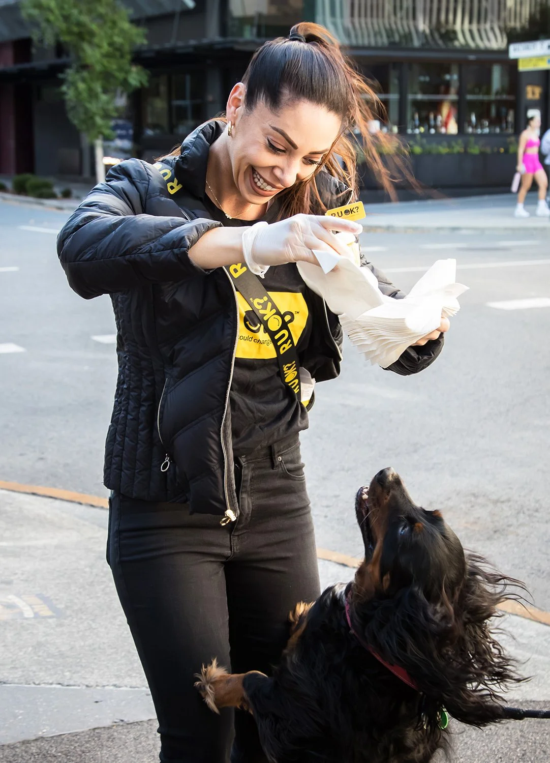 Promo staff with dog at R U OK? Day activation
