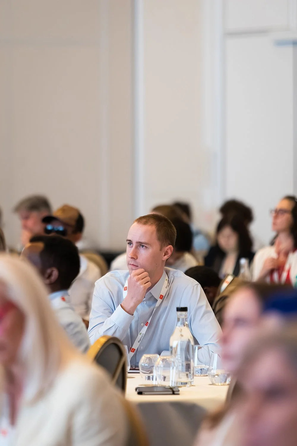 Engaged audience members during a conference at Brisbane Sofitel Central