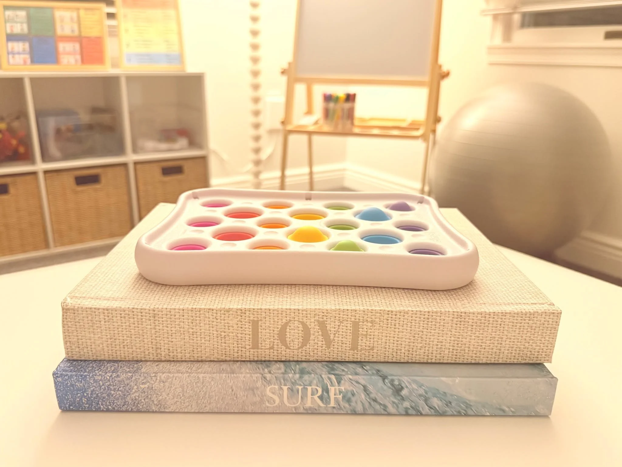 At Point Wellness Co., even the little details have a purpose. Our spaces are thoughtfully designed to support connection, comfort, and creativity. Art supplies, fidgets, movement tools, and quiet details throughout the room give clients of all ages 