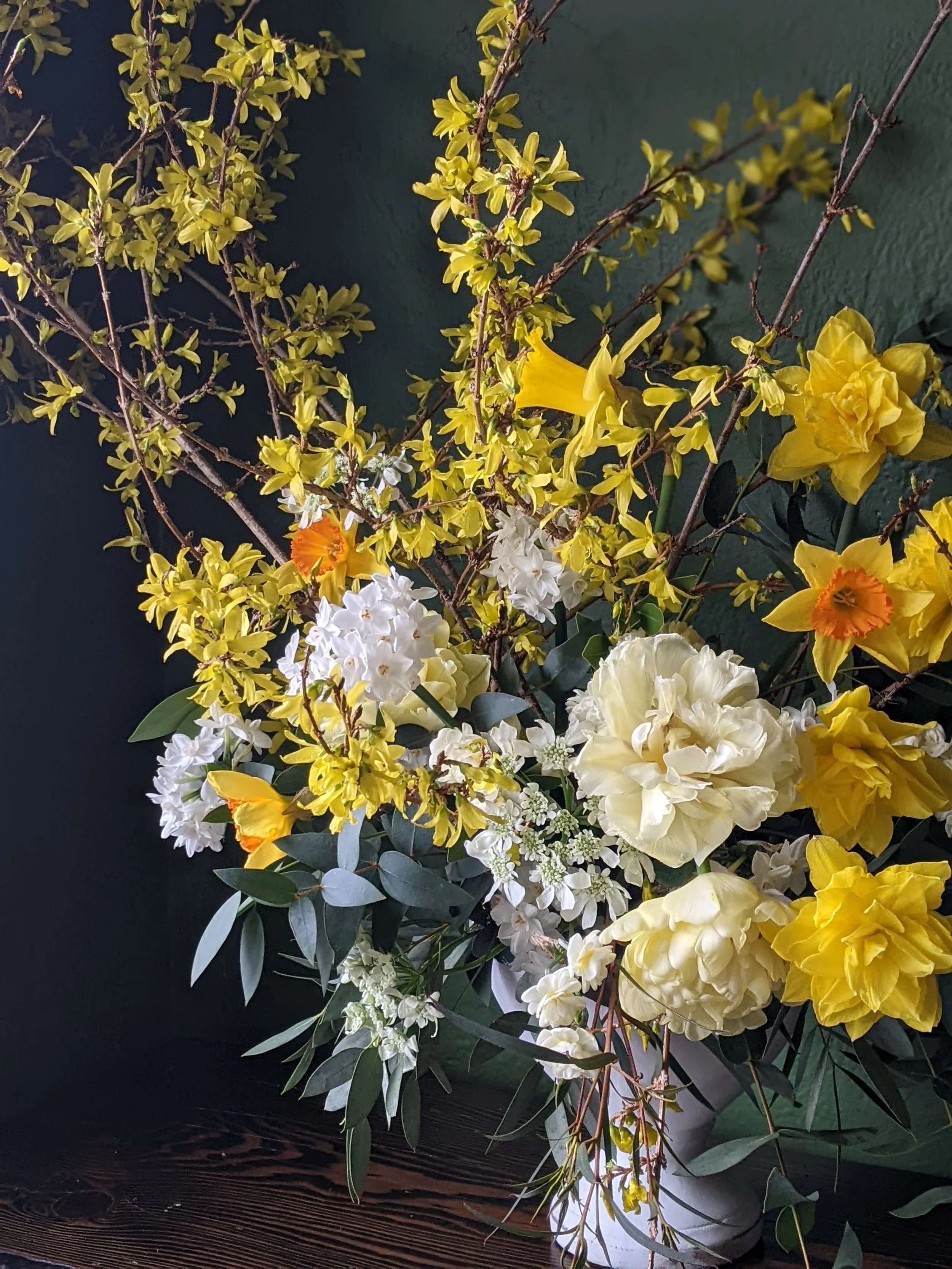 daffodils and forsythia in urn.jpg