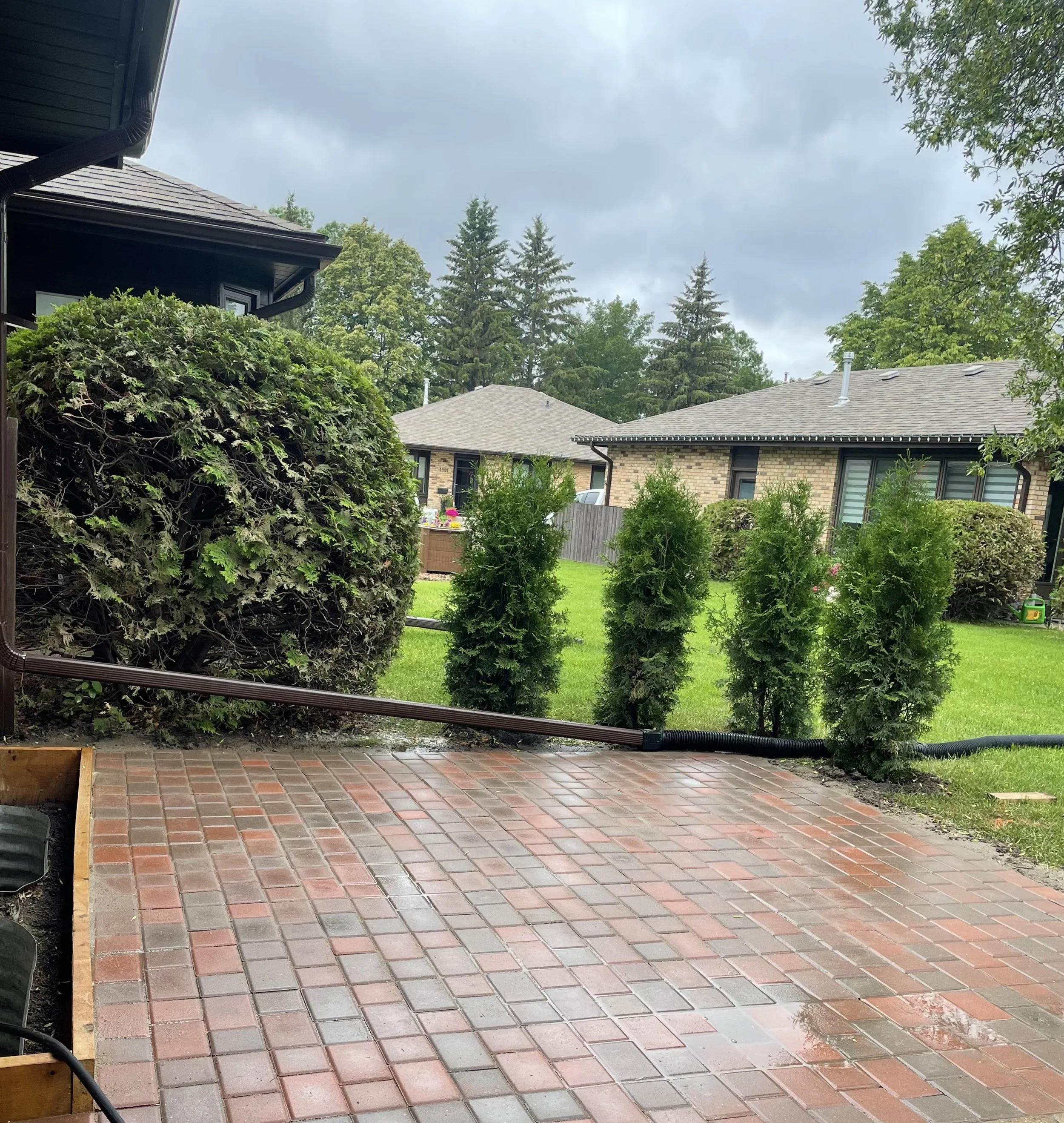 Natural stone paver walkway with garden bed borders in Briarwood Saskatoon by Lennox Landscaping