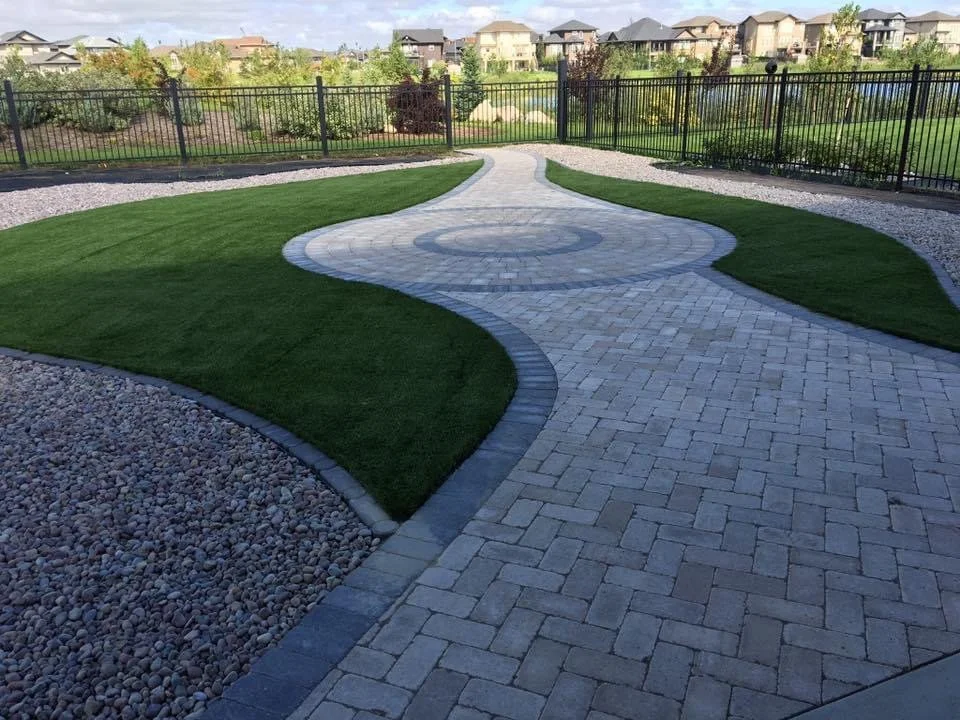 Barkman interlocking paver driveway and and front walkway with contrasting border detail in Briarwood Saskatoon