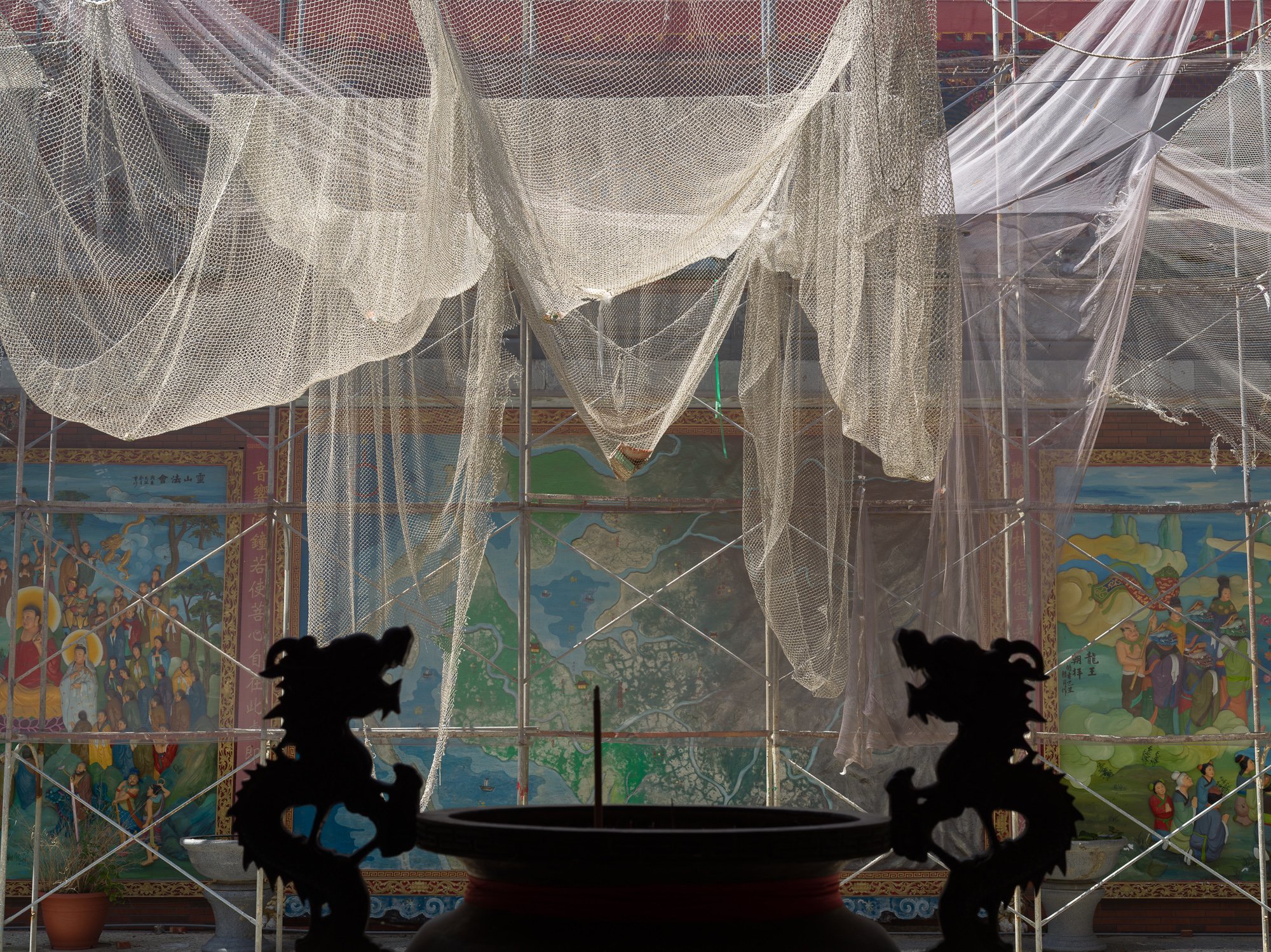 Renovation of a Daoist temple. The mural in the background depicts how this area was an inland sea hundreds of years ago.

Ka-lí, Tainan, Taiwan 2021.