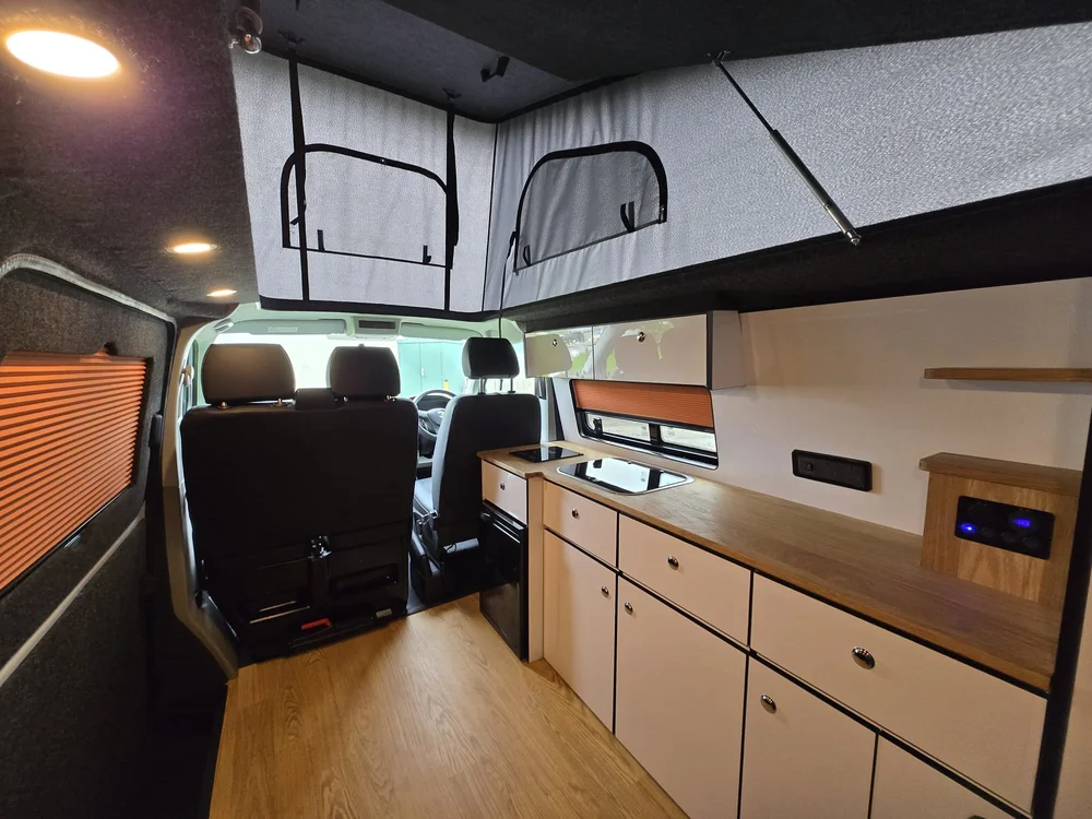 Rear storage system in a VW T6.1 camper conversion providing practical space for family adventures