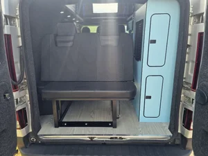 Rock and roll bed inside a Renault Trafic campervan conversion