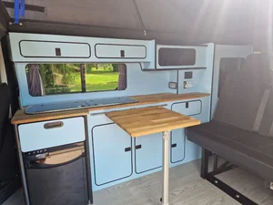 Bespoke kitchen with oak worktop in a Renault Trafic campervan conversion