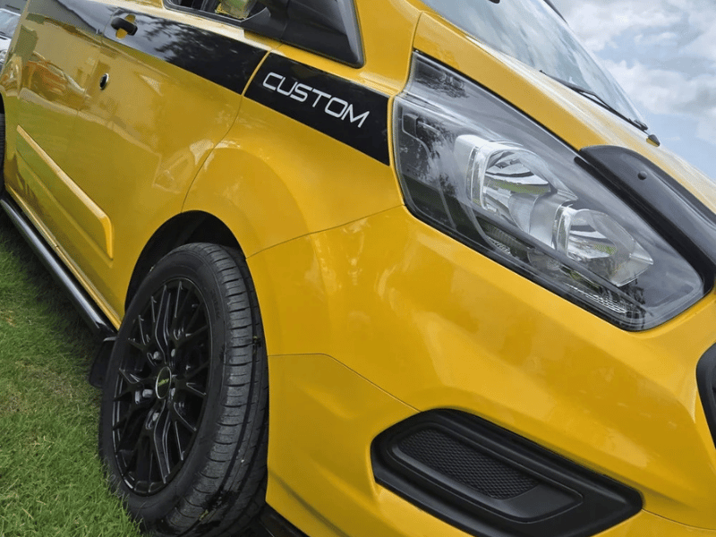 Exterior view of Ford Transit Custom campervan conversion in yellow and black