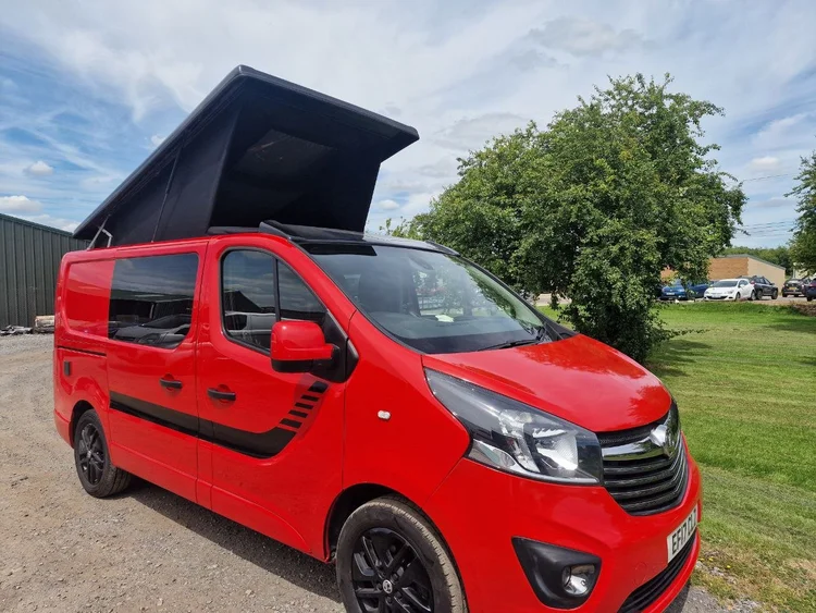 Custom Vauxhall Vivaro day van conversion in red and black