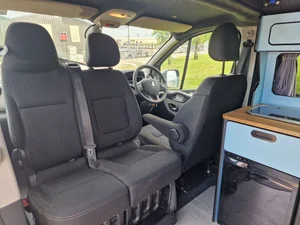 Swivel passenger seat inside a bespoke Renault Trafic campervan conversion