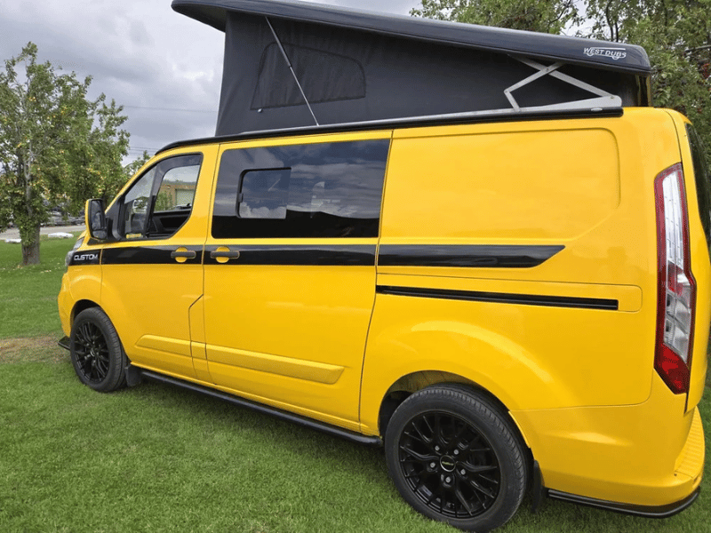 Side profile of yellow Ford Transit Custom camper conversion