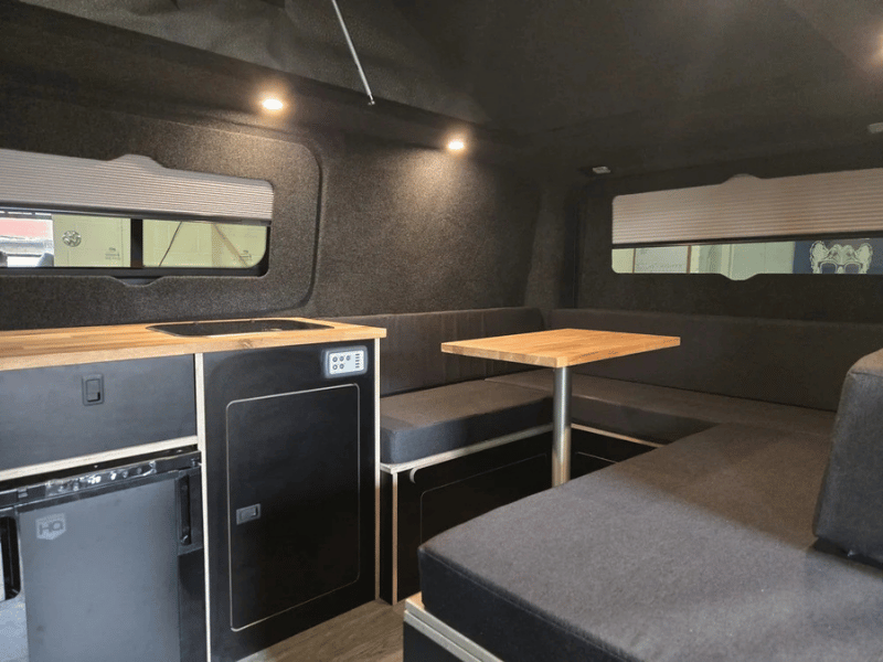 Seating area inside Ford Transit Custom campervan conversion