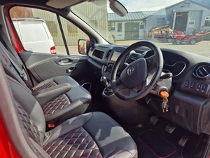 Custom front seat upholstery in a Vauxhall Vivaro camper conversion
