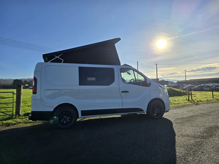 Side profile of the Fiat Talento camper conversion with pop-top roof raised.