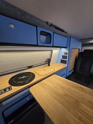 Kitchen area with induction hob in the Volkswagen T6 camper Joan