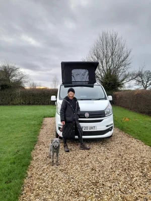 Customer collection of the Fiat Talento camper conversion Milky with pop-top roof raised.