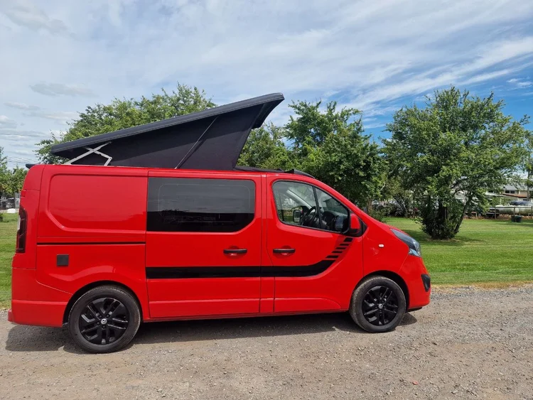 Red and black Vauxhall Vivaro campervan conversion by Grizzly Custom Vans