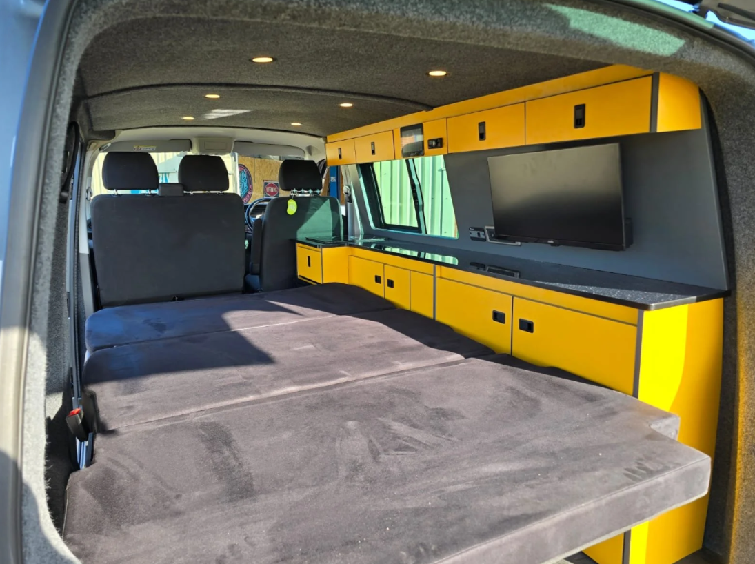 Custom storage solutions designed for family travel inside a VW T6.1 camper conversion