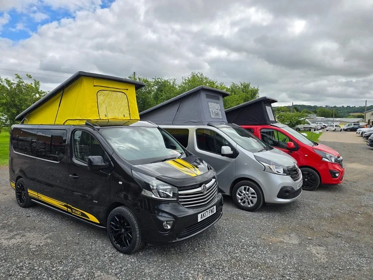 Beefy custom Vivaro campervan alongside other campervan builds at Grizzly Custom Vans