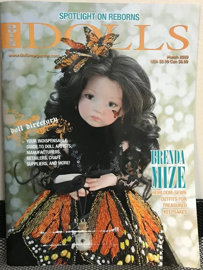 Magazine cover for 'Dolls' magazine featuring Brenda Mize's Award-winning Monarch butterfly named Chrysalis.  Chrysalis won both the Industry's Choice as well as Public's Choice Award in 2019.