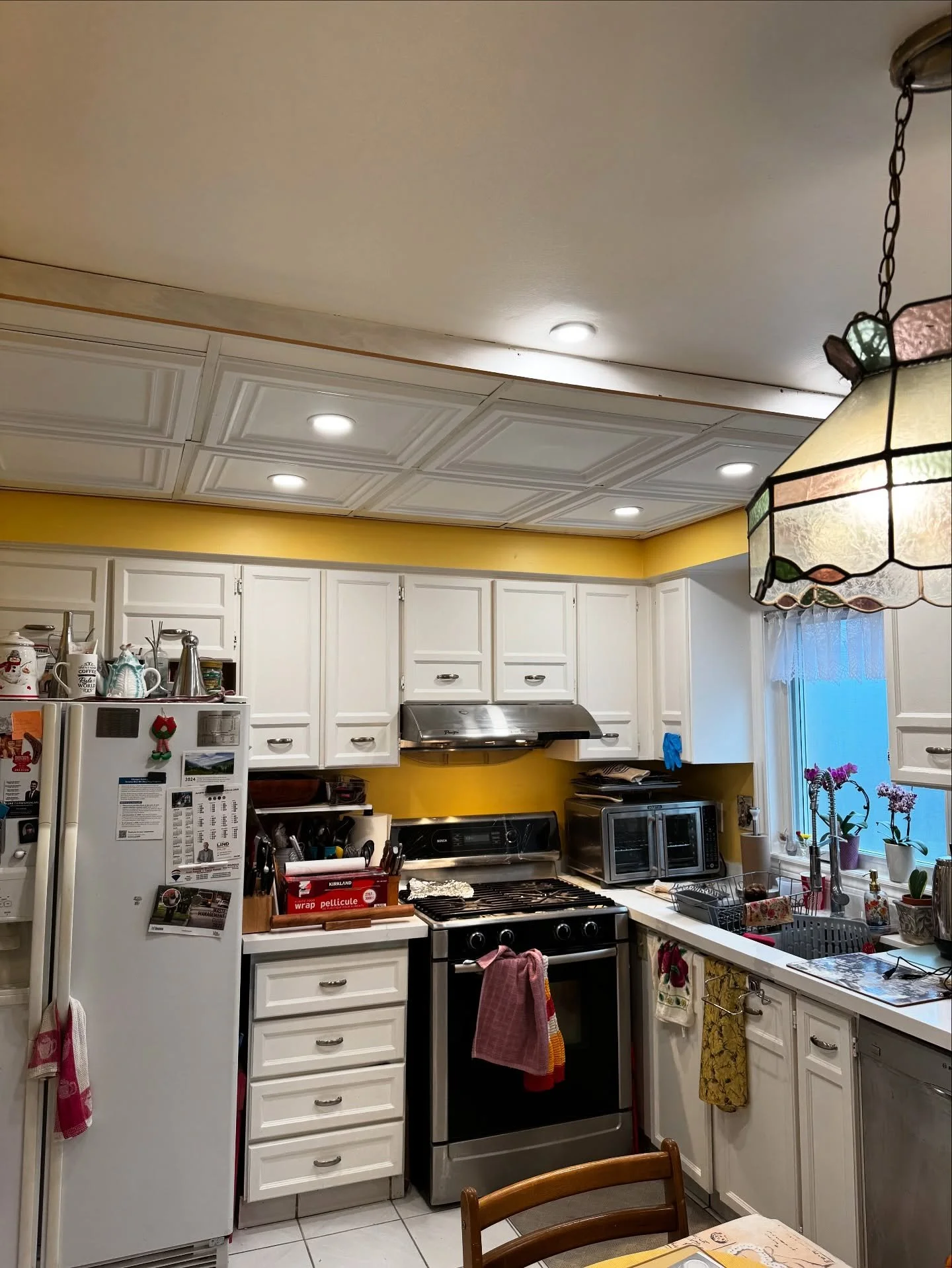 ✨ Kitchen Glow-Up Complete! ✨
We swapped out outdated recessed fixtures and ceiling panels for energy-efficient LED pot lights with a fresh, clean trim &mdash; all while preserving the aesthetic of this cozy kitchen space. Swipe to see some of the me