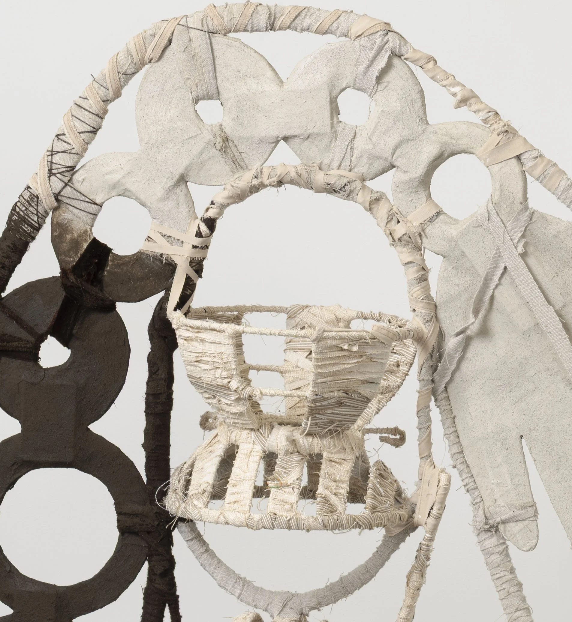  The Bean Counter,  2025 
Found objects, repurposed textiles, earth and mineral pigment 
59 x 60 x 16.5 inches
 
Image by Pierre Le Hors