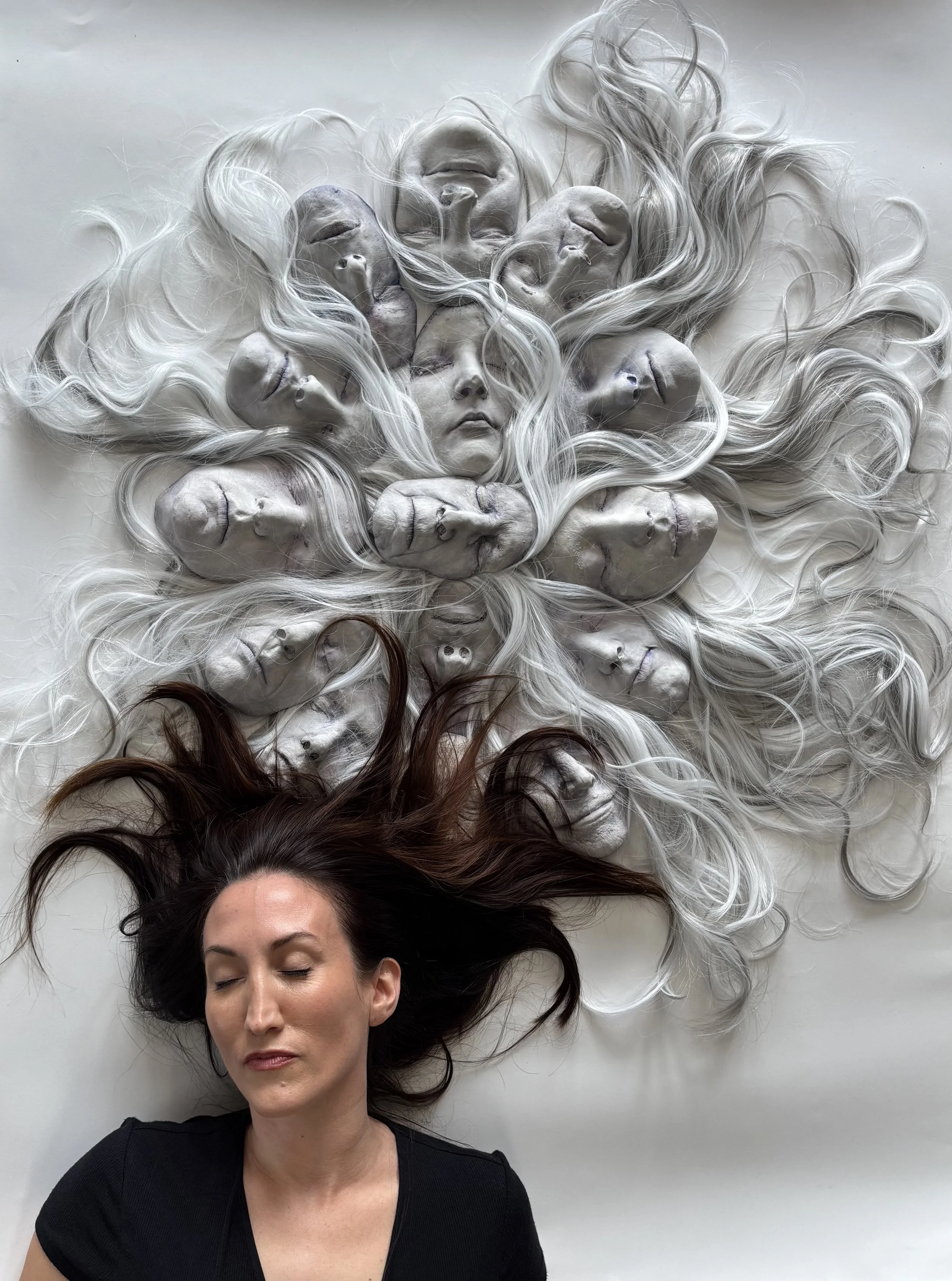 Kelly Tomasello with work titled DIVINE FEMININE, 2026 plaster, synthetic hair, watercolor 