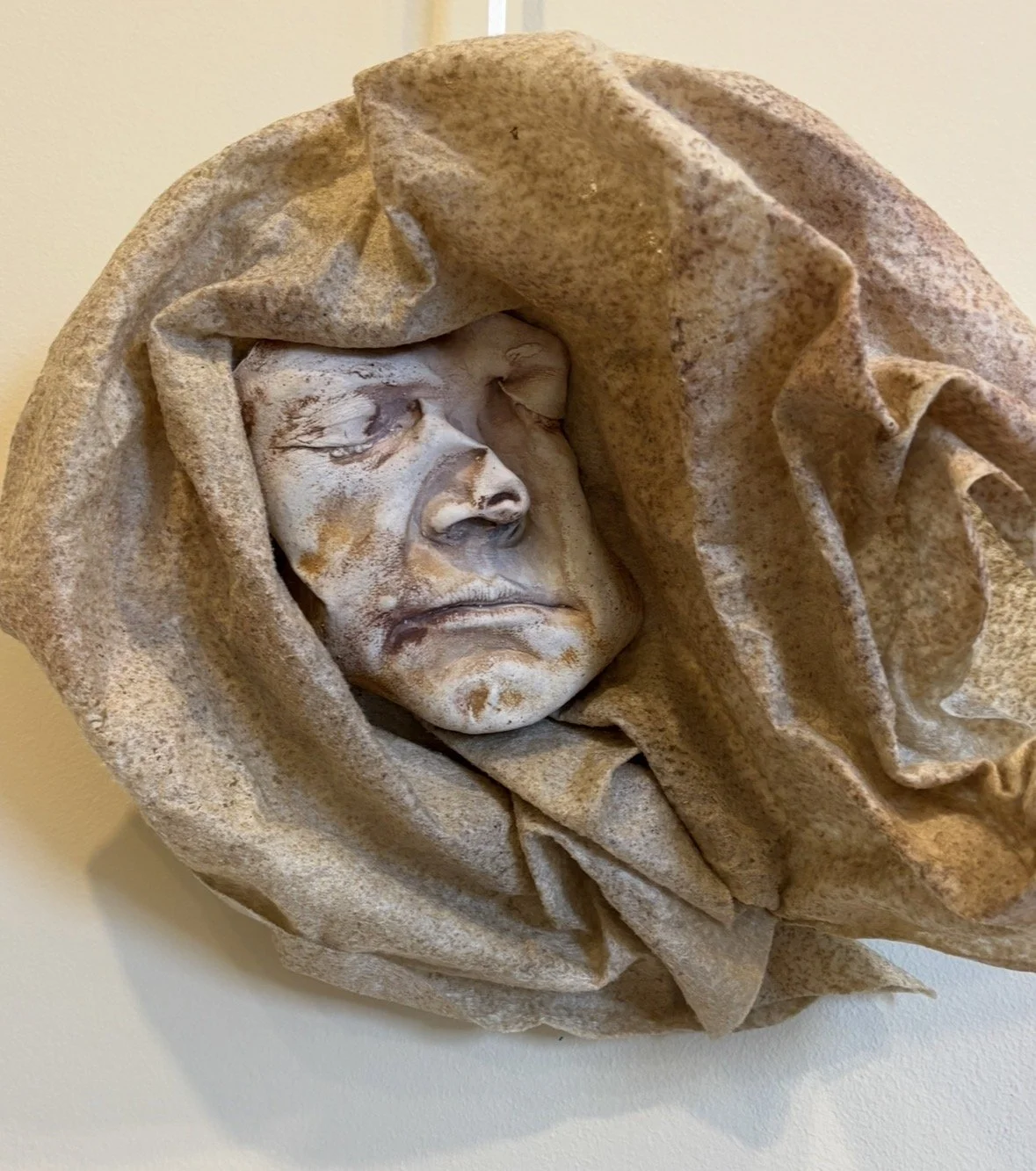 FINDING FACES IN THE FOLDS, 2026, plaster, fabric, watercolor 
