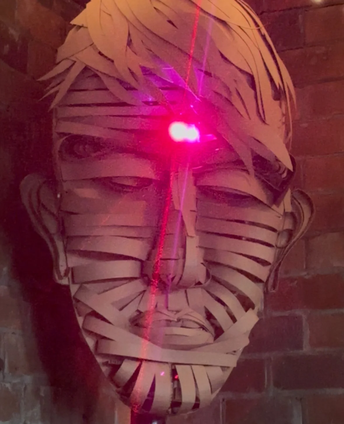 Untitled, 2025 
cardboard and laser lights 