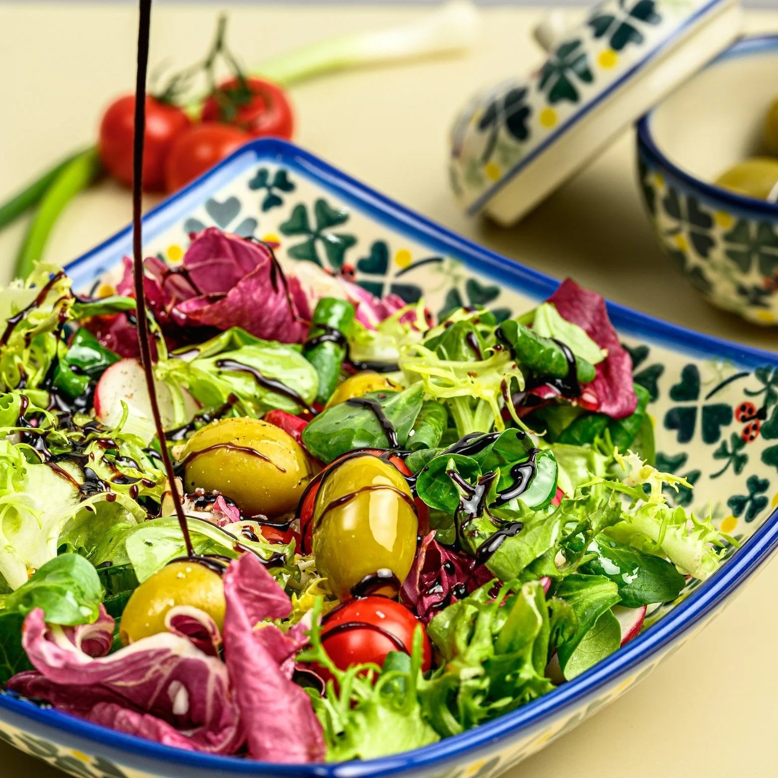 Blue patterned plate with salad symbolising Nourishment Pillar of Holistic Health Artistry Practice