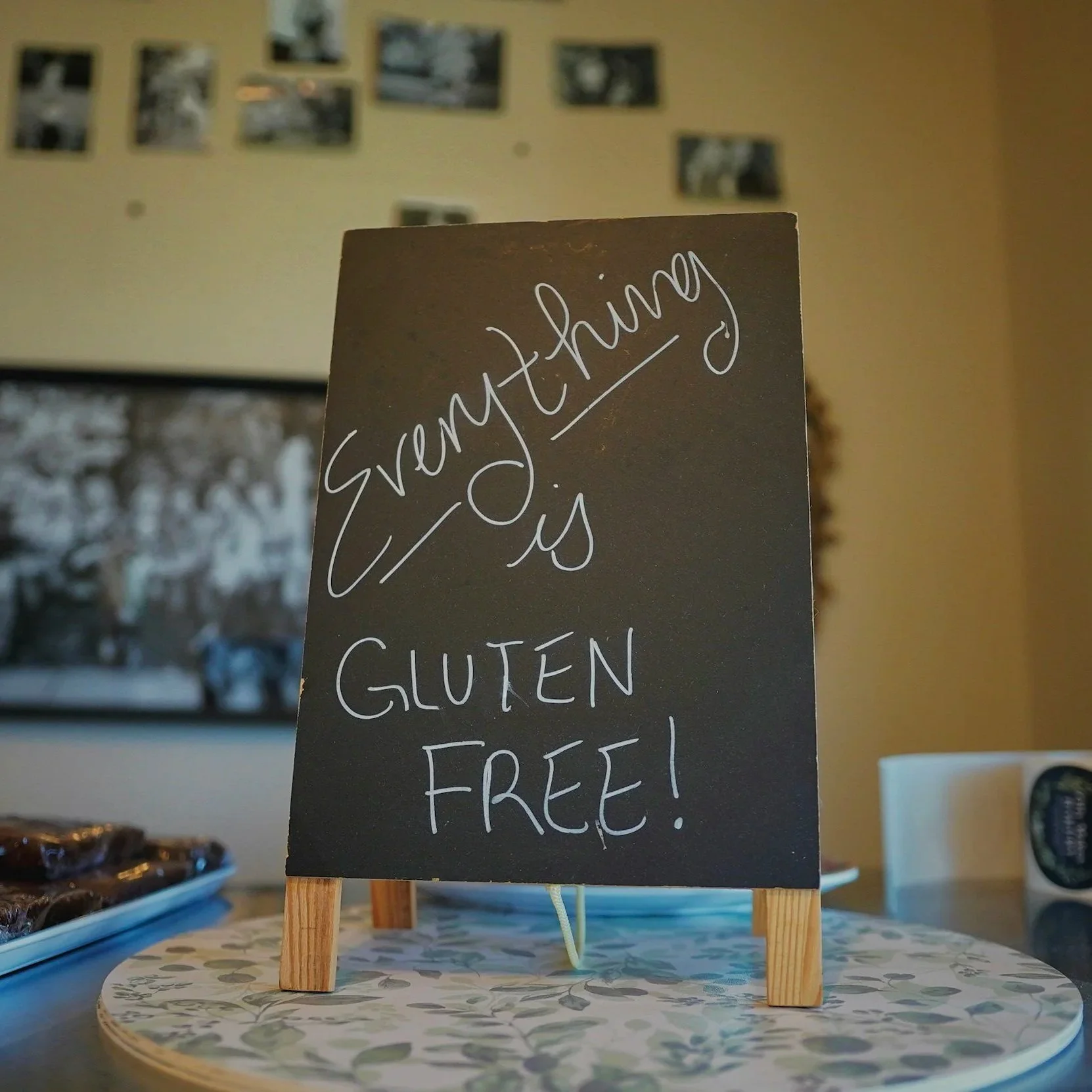picture of a sign saying everything is gluten free symbolising The family table, journal notes on living a gluten free life as family or individual holistic health artistry