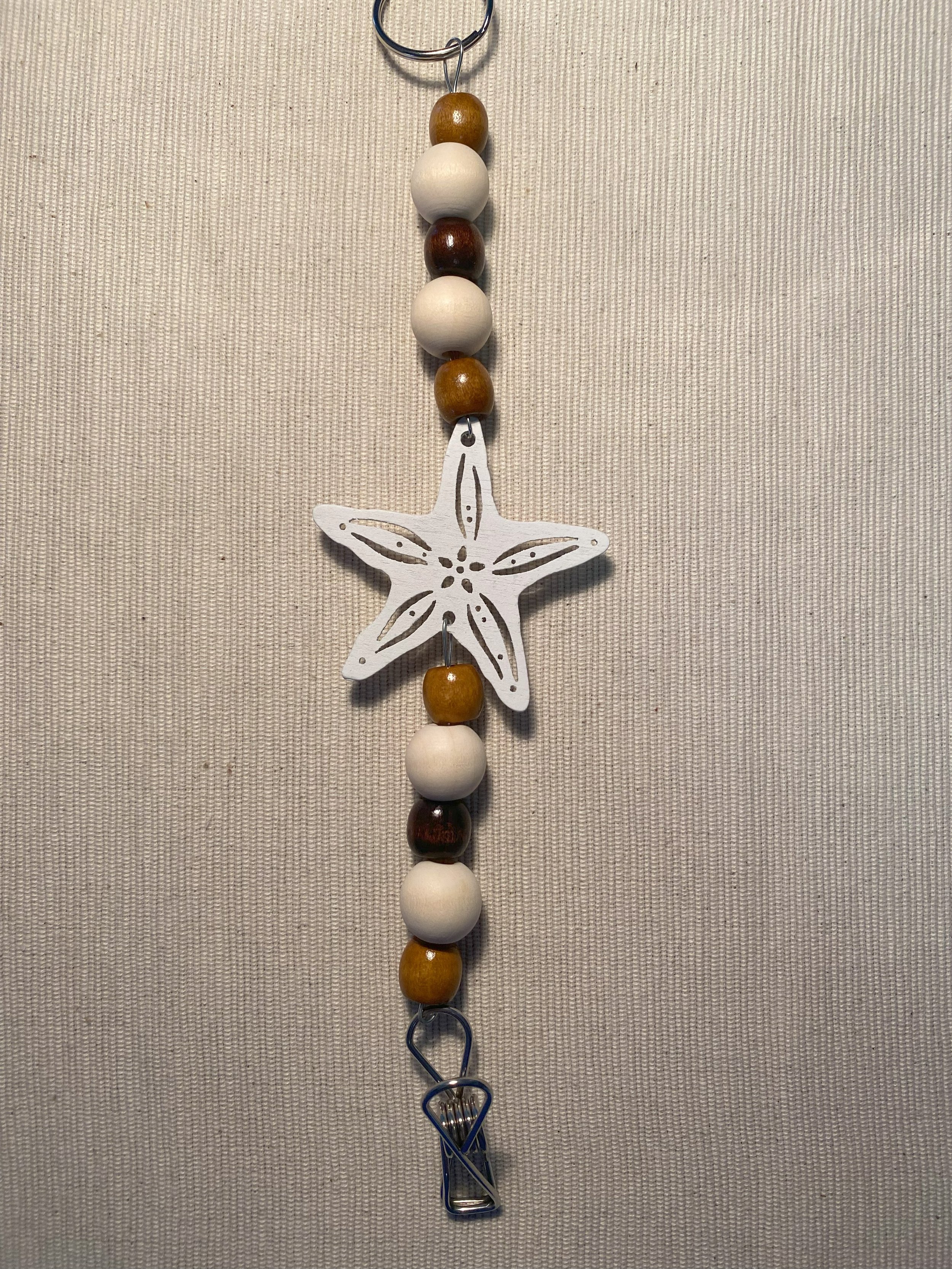 White Starfish Mozzie Coil Hanger with Light Coffee Beads and a Dark Coffee Feature Bead