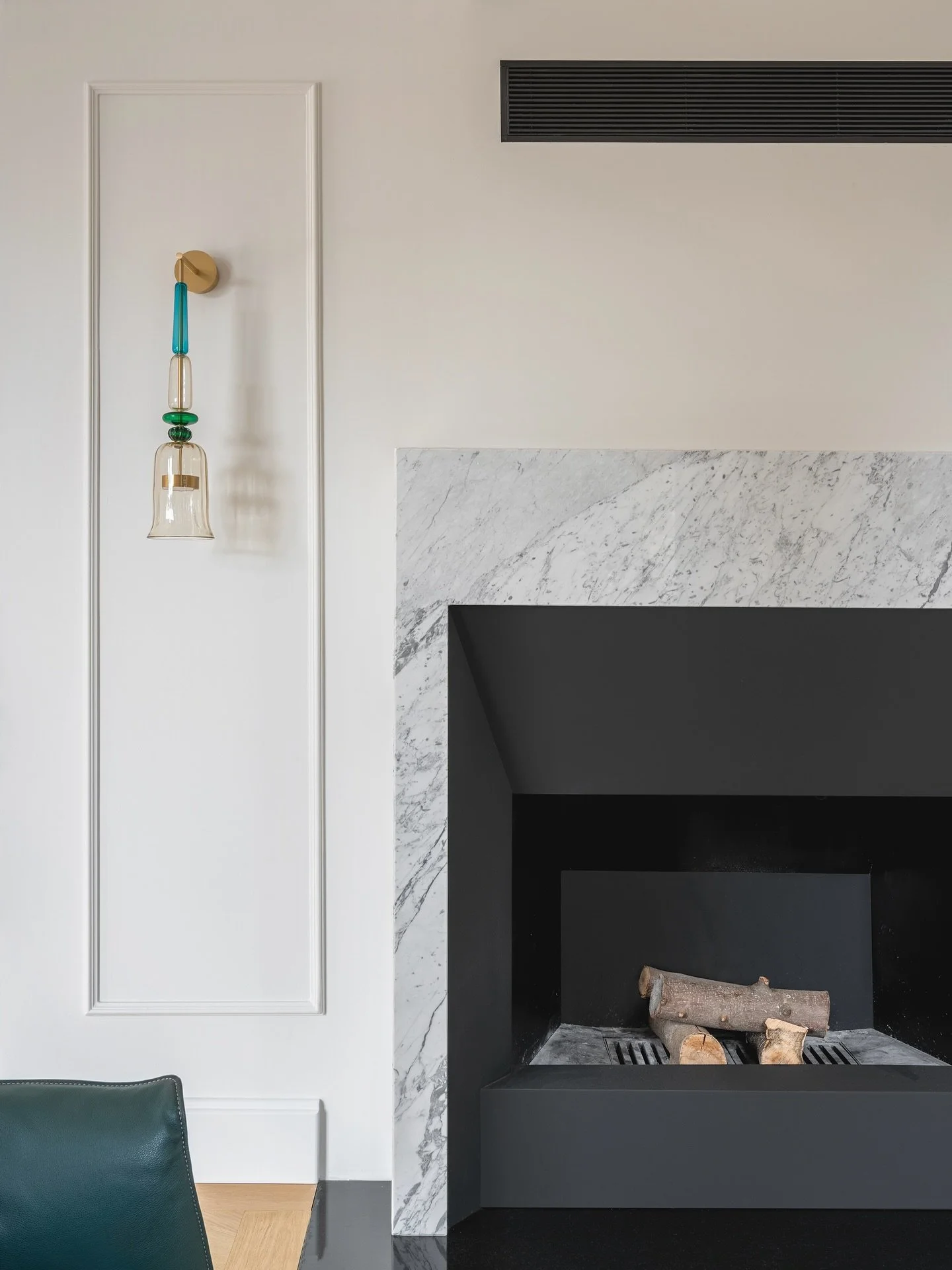 The fireplace | A sense of presence and permanence that grounds the home, aglow with warmth or settled in calm.