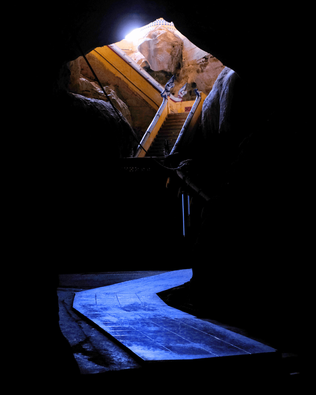 Steps inside the mountain at Tham Phra Chaison