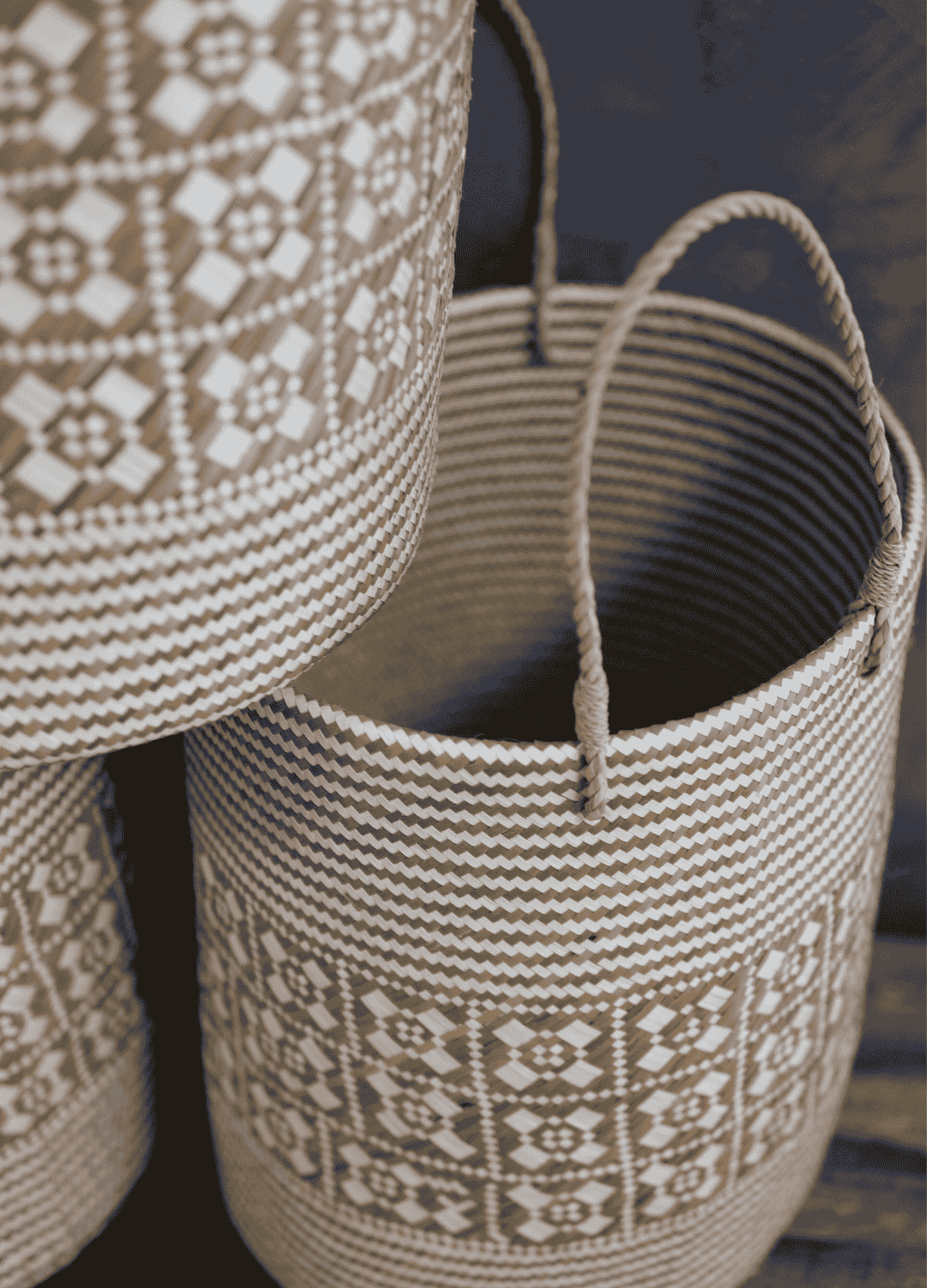 Close-up of two stacked Sailom baskets, highlighting the geometric weave and natural texture.