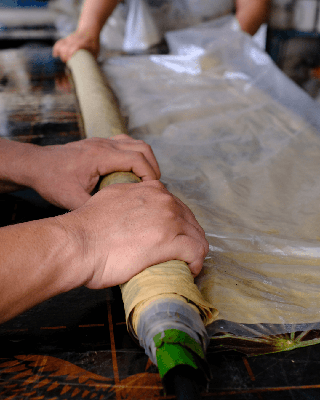 Botanical print canvas is rolled.