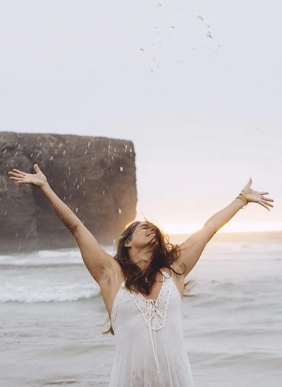 erotic women in white dress splashing with water