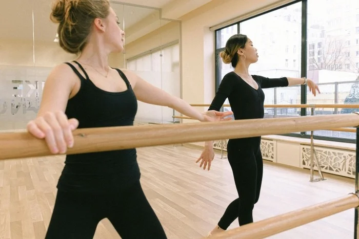 A woman practicing ballet.