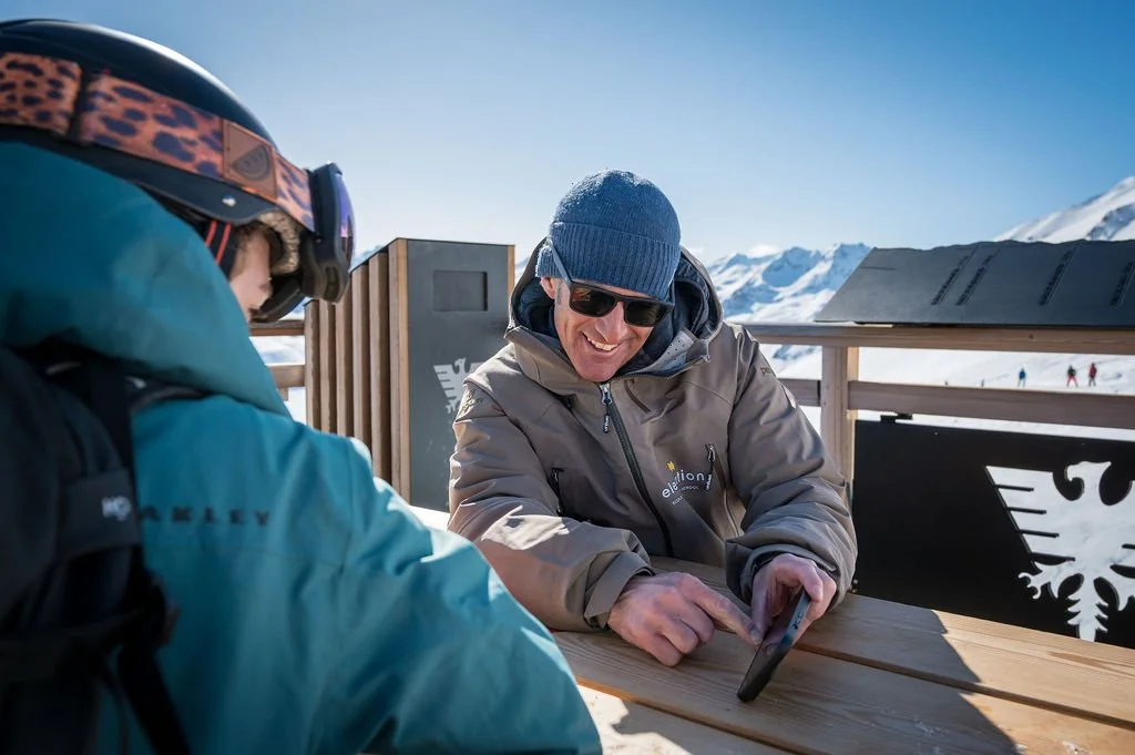 image shows ski instructor simon mccombe showing video feedback during ski lesson