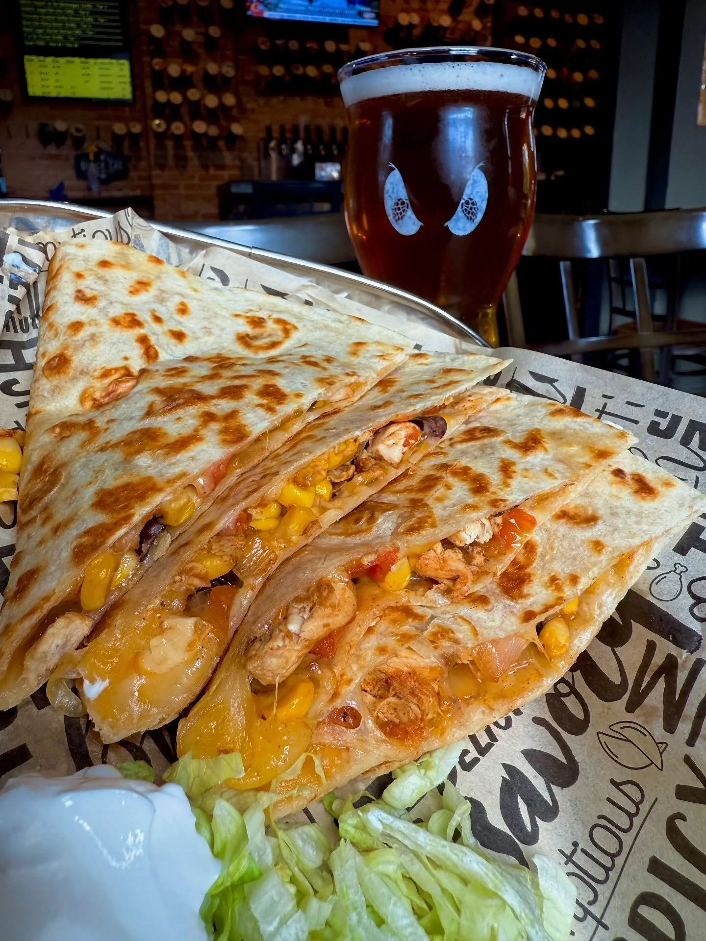 Our glorious special this weekend - 𝗧𝗵𝗲 𝗦𝗼𝘂𝘁𝗵𝘄𝗲𝘀𝘁 𝗖𝗵𝗶𝗰𝗸𝗲𝗻 𝗤𝘂𝗲𝘀𝗮𝗱𝗶𝗹𝗹𝗮 ✨ Chock-full of chicken breast, tomato, white onion, corn, and cheddar jack cheese on a flour tortilla. Stop in and give it a try while it lasts! Pair i