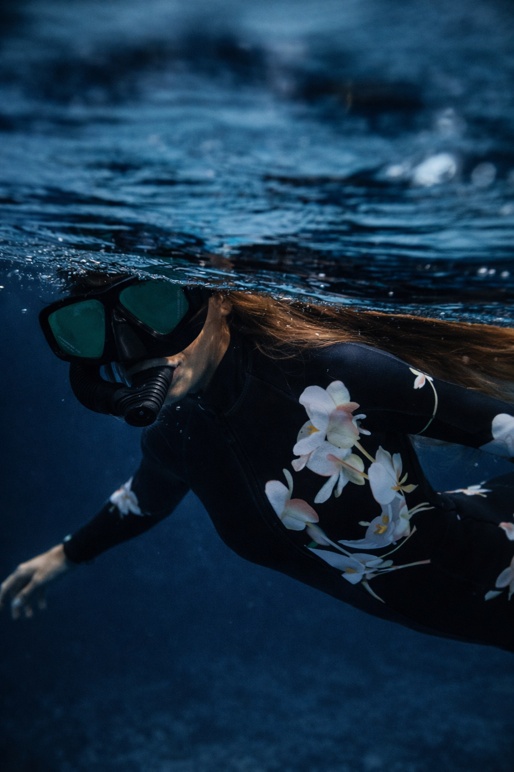 Luxury floral wetsuit for women inspired by ocean movement and performance design