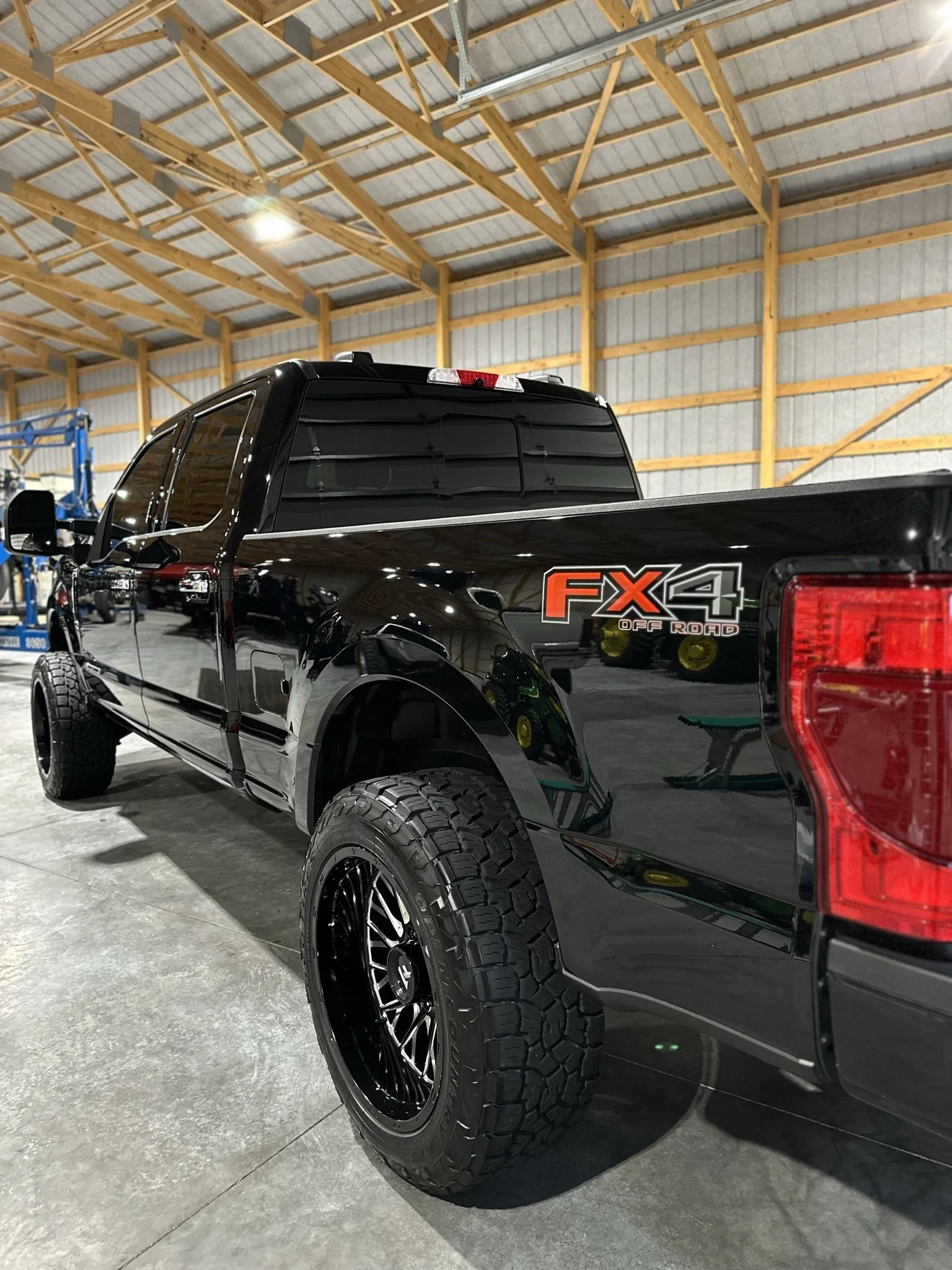 back of clean black truck after premium detailing