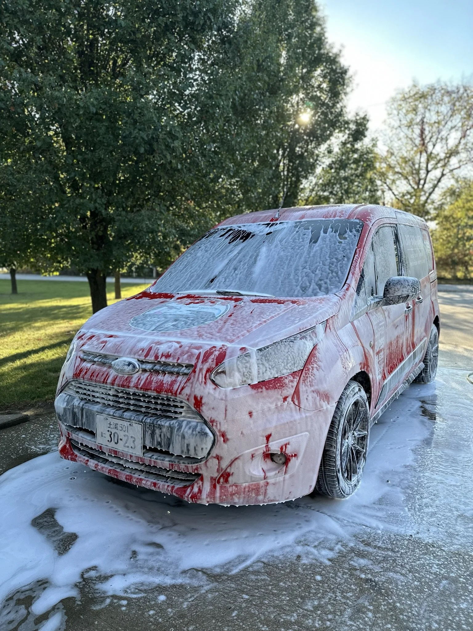 red car with soap suds