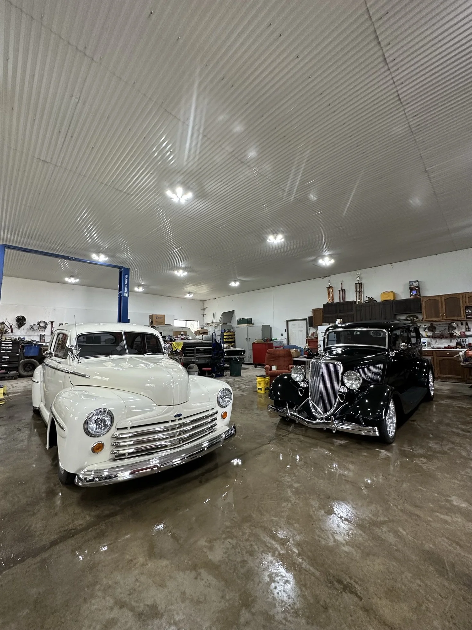 clean white car and clean black car after detail