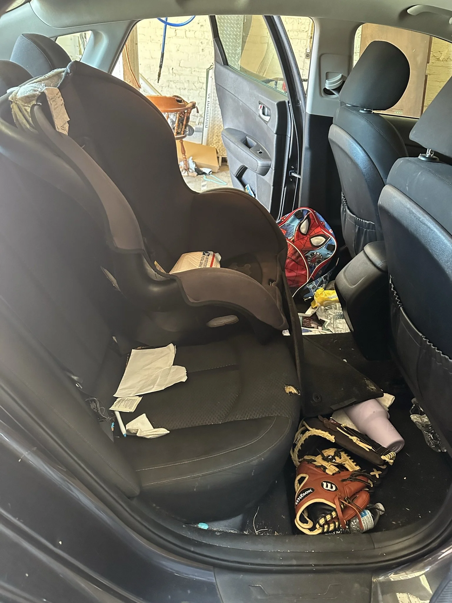 dirty back seat of car