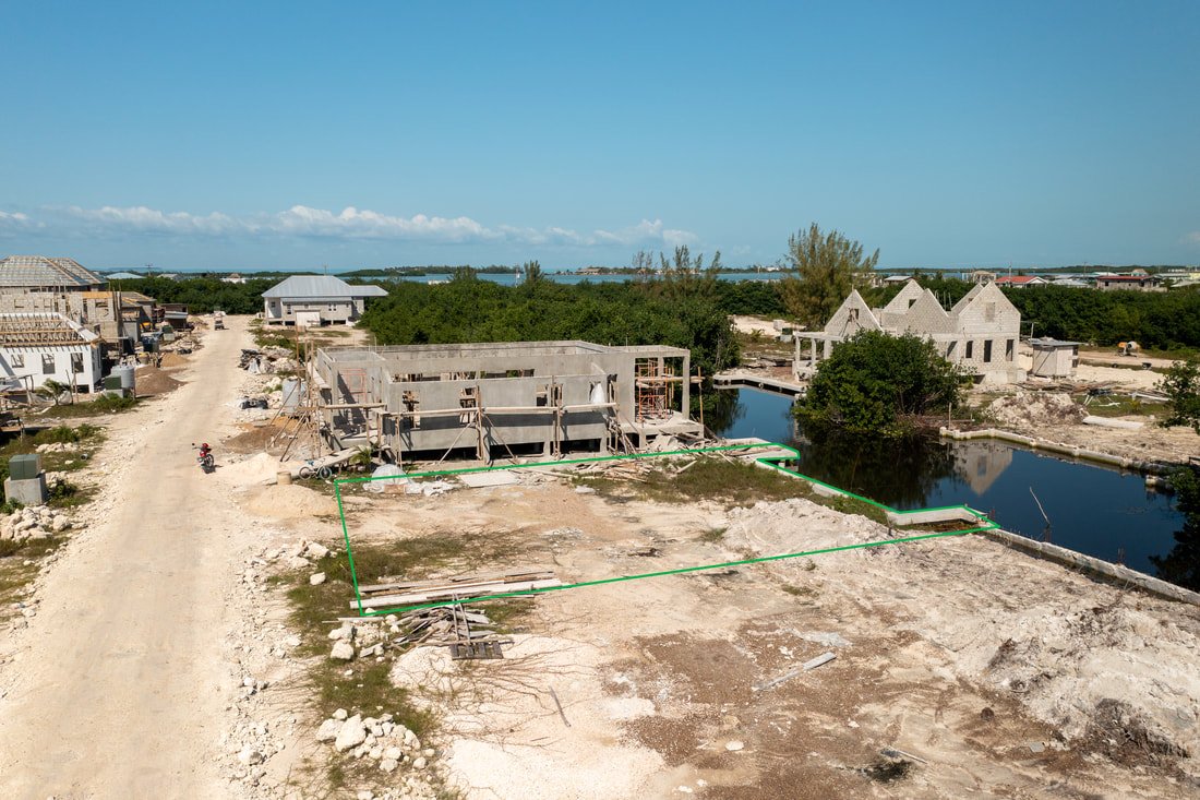Sea wall and boat slip already in place. Financing at 50% down.

Mahogany Bay Village lot comes with the infrastructure done&mdash;sea wall and boat slip both built. 3,750 sq ft, neighborhood has rules so your investment's protected. Two miles south,