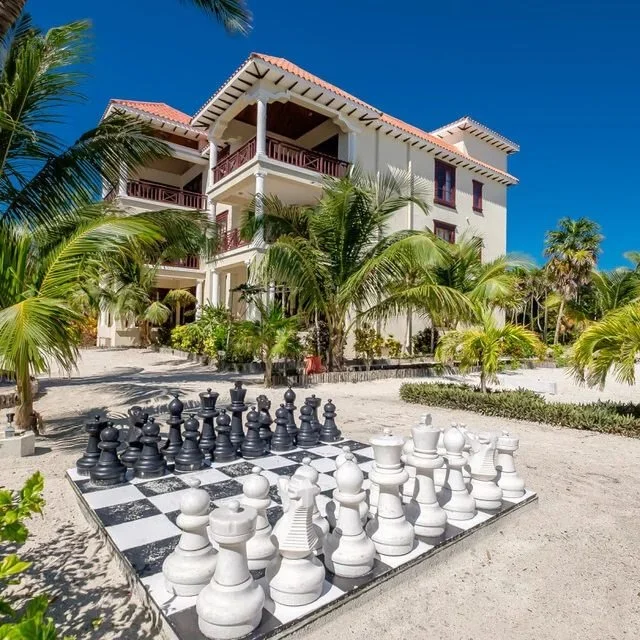 Eight and a half miles north feels different.

Mornings are quiet out here. You can sit on the balcony with coffee and watch the light come up over the water without boat traffic cutting through the view. Two king bedrooms, recent upgrades throughout