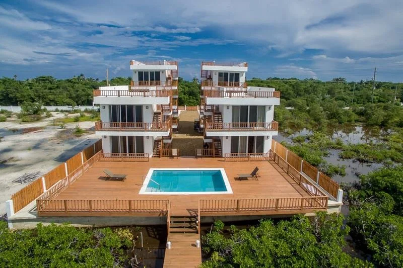 Two miles north of town, on the west side of the island, the pace changes. El Estero is a 10-unit building on the lagoon, quiet enough that the loudest thing most mornings is whatever's moving in the water. Unit C2 is a ground-floor 1-bedroom with a 