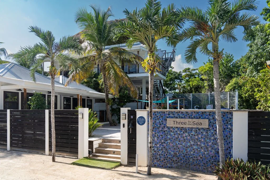 Most people buying a beachfront estate are buying a home. This one comes with a hotel license and a booking calendar that's already running.

Three By The Sea is six bedrooms across four separate units &mdash; a main 3-bedroom house, two private casi